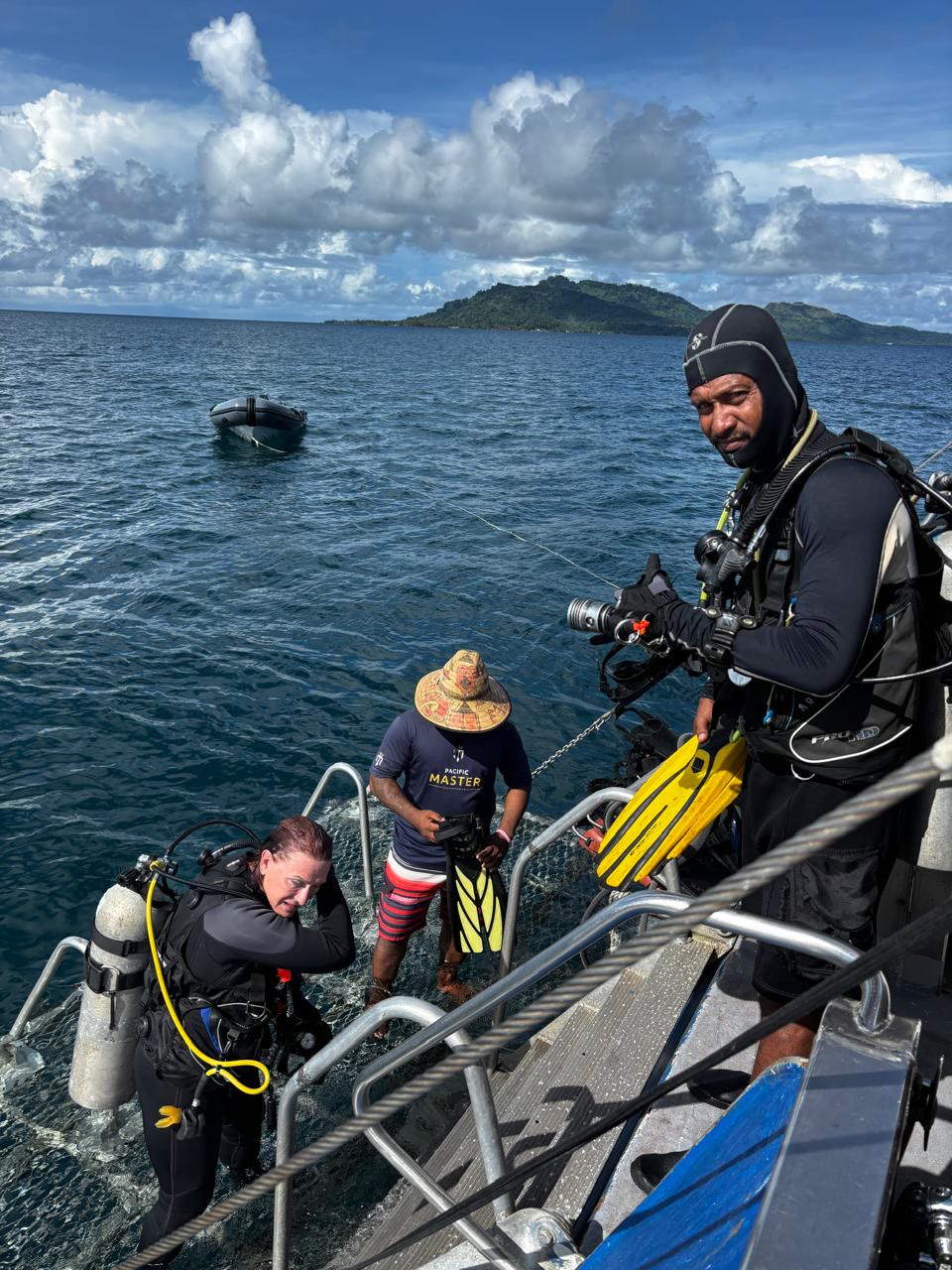 Divers entering the water off the boat, Chuuk